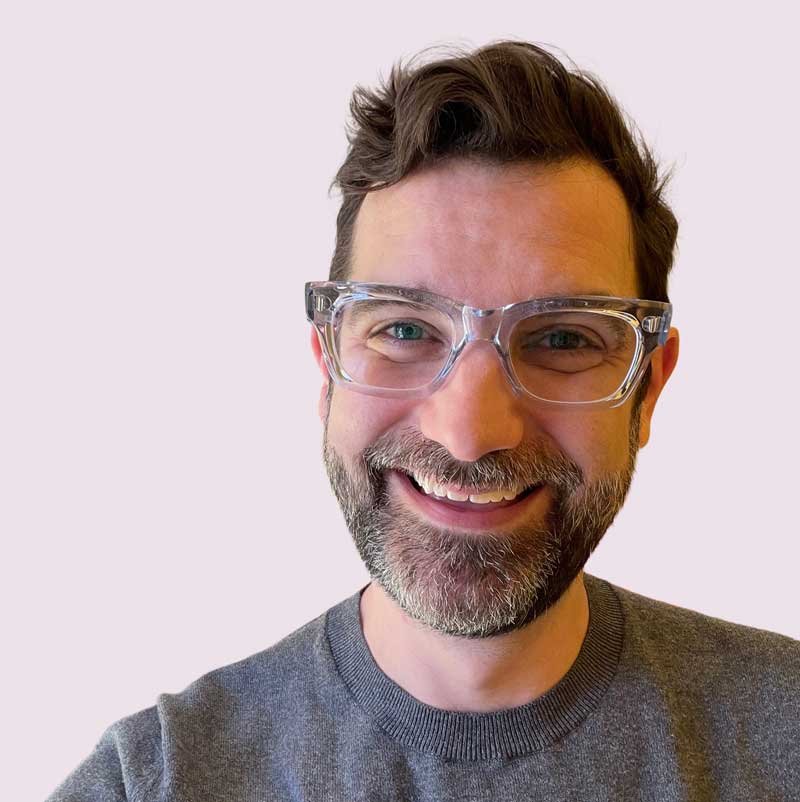 Headshot of Ryan Hugh Mackey smiling